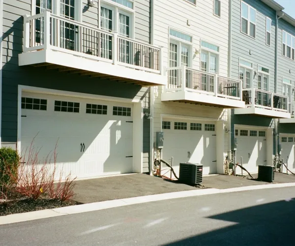 white concrete building beside road during daytime
