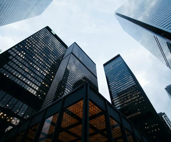 low angle photo of city high rise buildings during daytime